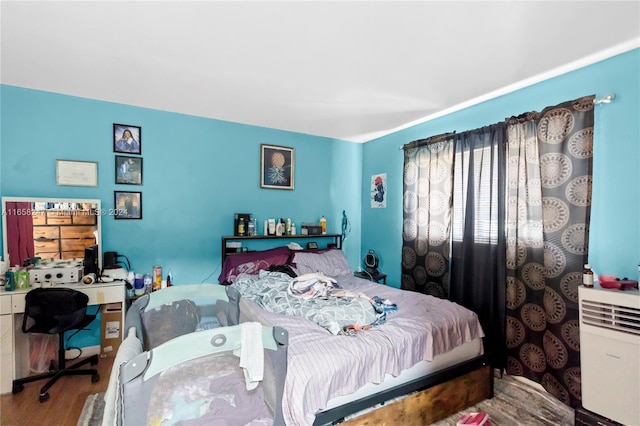 bedroom with wood-type flooring