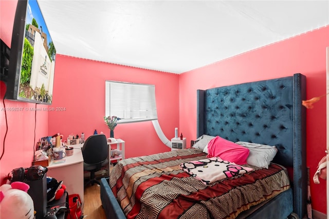 bedroom featuring hardwood / wood-style flooring