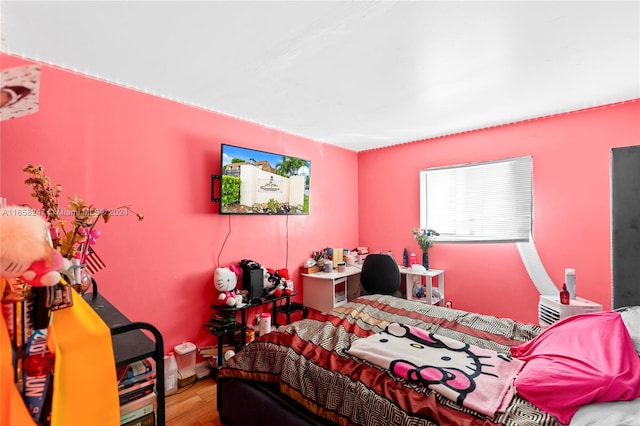 bedroom with wood-type flooring