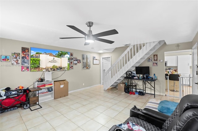 living room featuring ceiling fan and light tile patterned floors