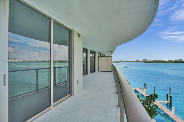 balcony featuring a water view