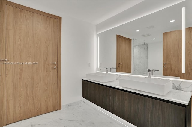 bathroom featuring vanity and an enclosed shower