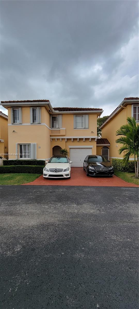 view of front of property with a garage