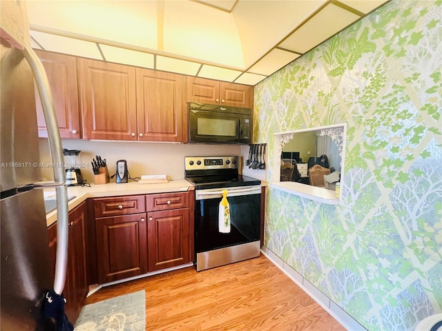 kitchen with light wood-type flooring and stainless steel appliances