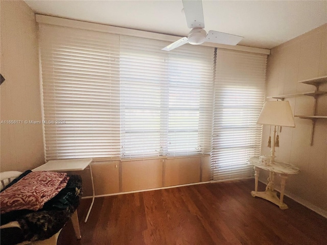 interior space with wood-type flooring and ceiling fan