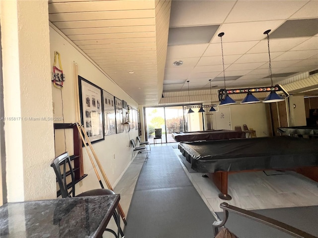 game room with a paneled ceiling and pool table