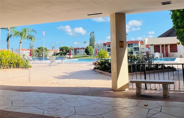 view of patio with a community pool