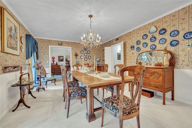 carpeted dining area featuring ornamental molding and a notable chandelier