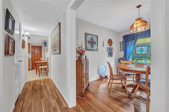 dining space featuring hardwood / wood-style flooring