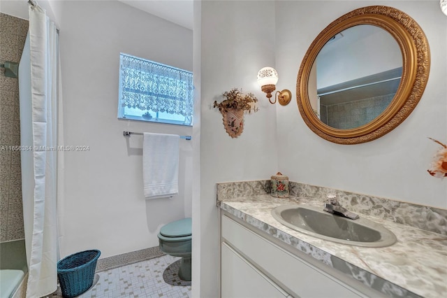 bathroom with vanity, toilet, and walk in shower