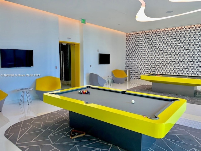 playroom featuring dark tile patterned floors and pool table