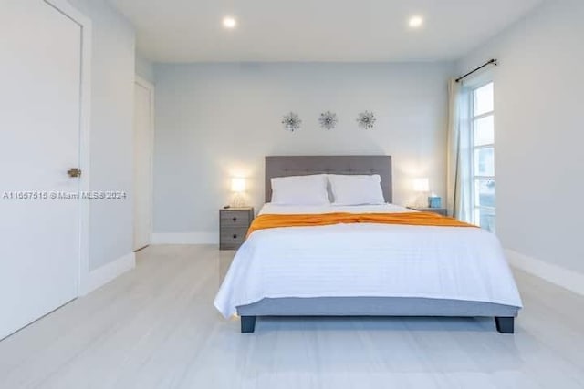 bedroom with light hardwood / wood-style flooring