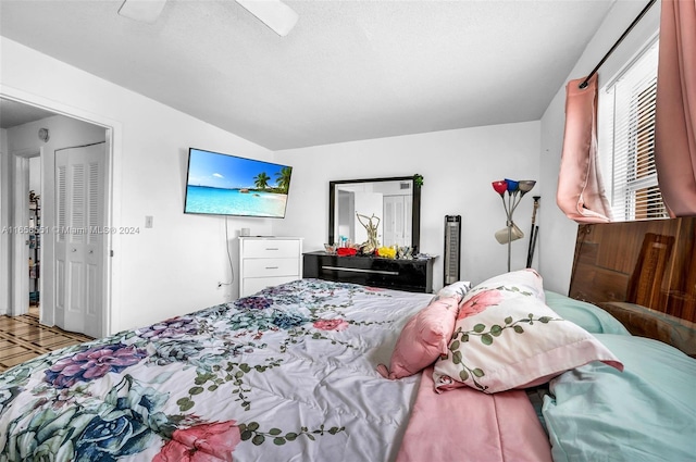 bedroom featuring ceiling fan and a closet