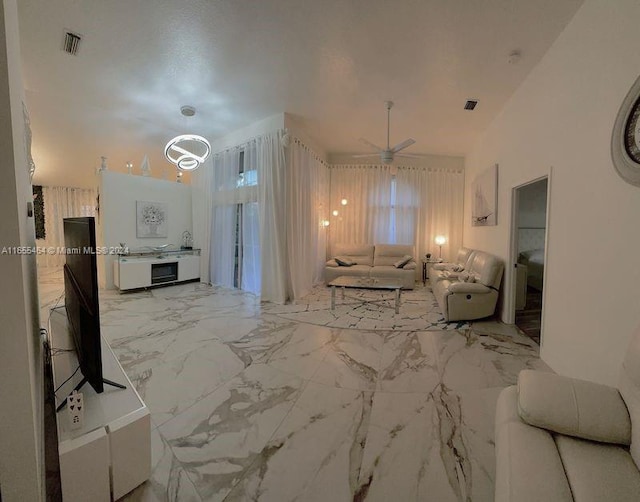 living room featuring ceiling fan