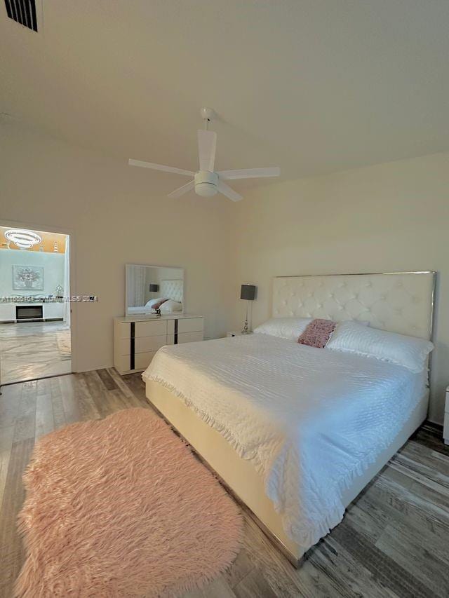 bedroom featuring ceiling fan and hardwood / wood-style flooring