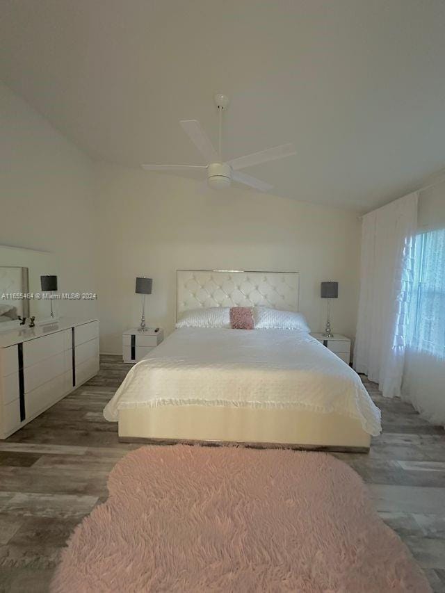 bedroom with ceiling fan and hardwood / wood-style flooring