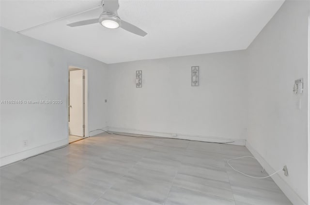 unfurnished room with ceiling fan