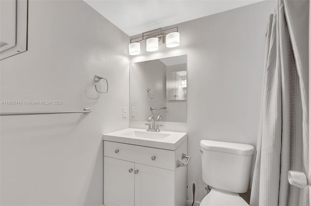 bathroom with toilet and vanity