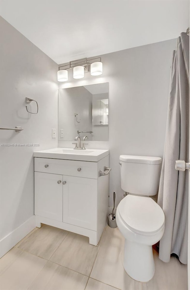 bathroom with toilet and vanity