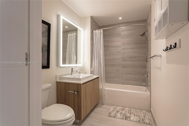 full bathroom featuring hardwood / wood-style floors, toilet, shower / tub combo, and vanity