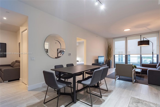 dining area featuring light wood-type flooring