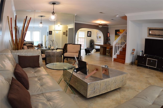 living room with ceiling fan and crown molding