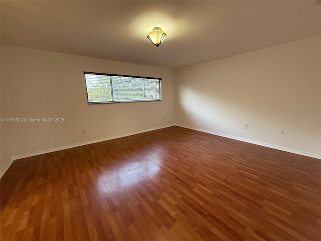 empty room featuring dark hardwood / wood-style floors