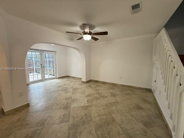 spare room with french doors, ceiling fan, and crown molding