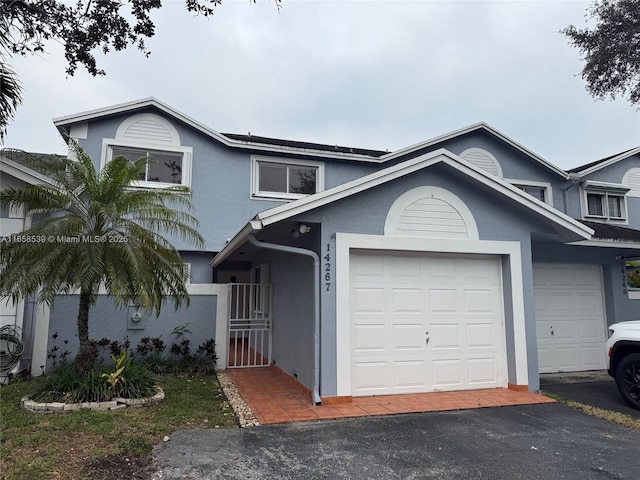 front of property with a garage