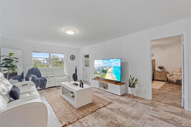 living room with a textured ceiling