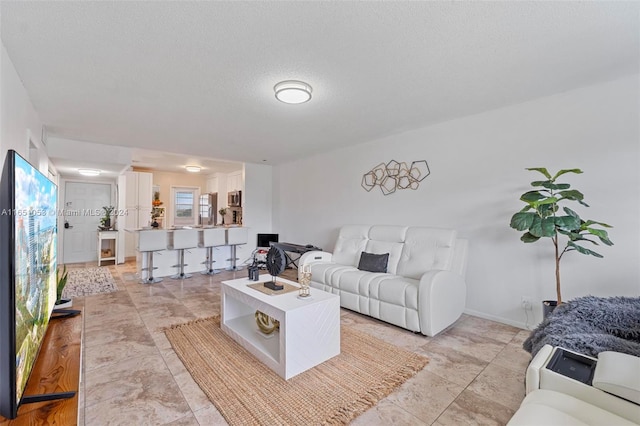 living room with a textured ceiling