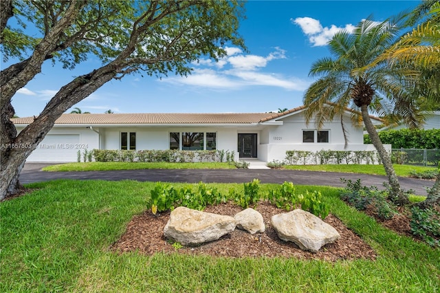 single story home featuring a garage