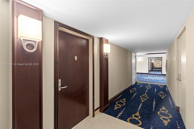 corridor with light tile patterned floors