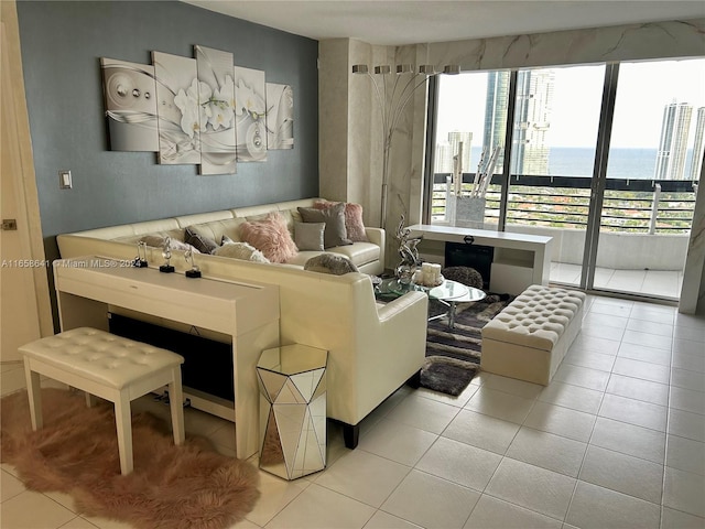 tiled living room featuring a water view and plenty of natural light