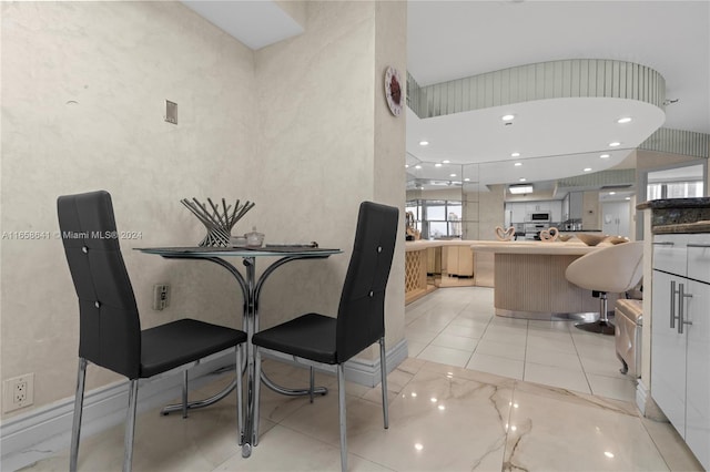 dining space with light tile patterned floors