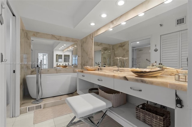 bathroom featuring vanity, plus walk in shower, and tile patterned floors