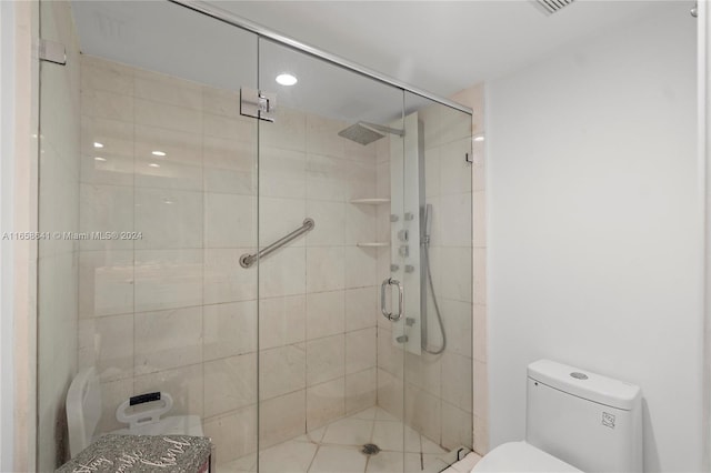 bathroom with walk in shower and toilet