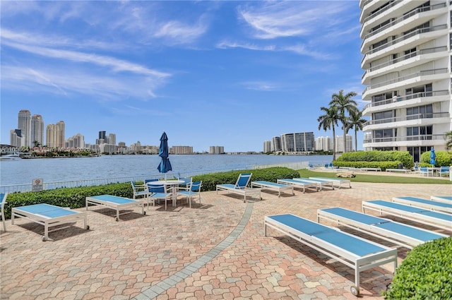 view of patio with a water view