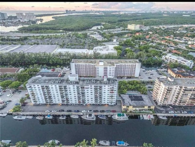 aerial view at dusk with a water view