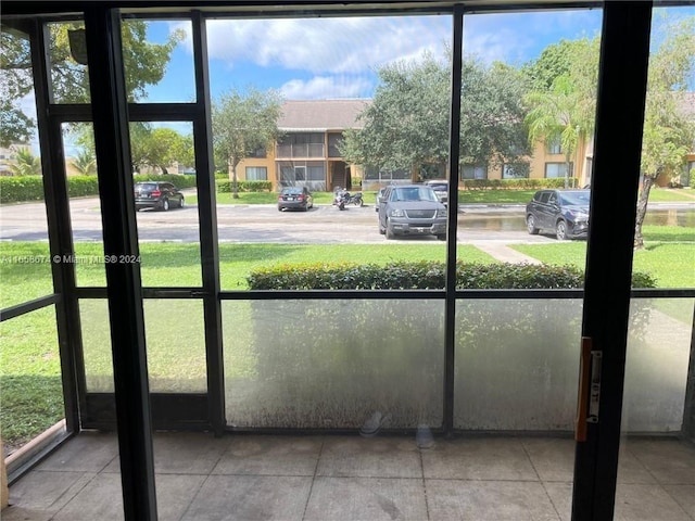 unfurnished sunroom featuring plenty of natural light