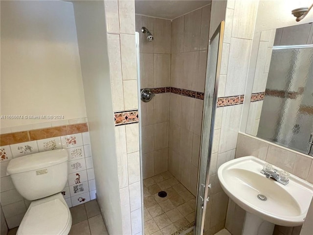 bathroom with backsplash, an enclosed shower, toilet, sink, and tile walls