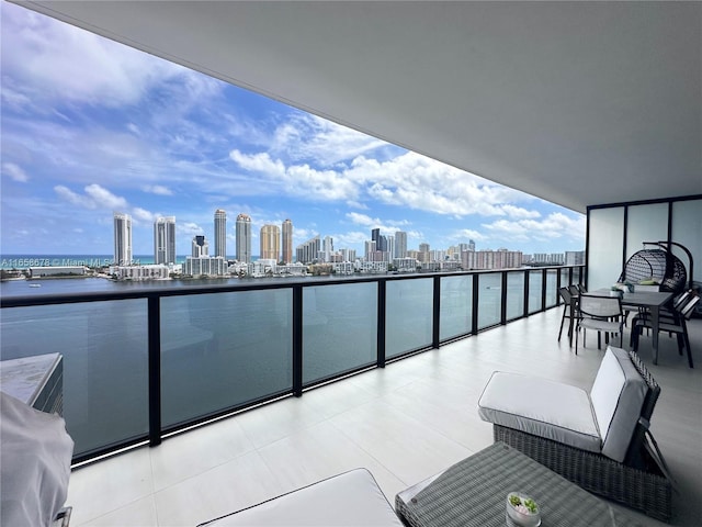 balcony with a view of city and a water view