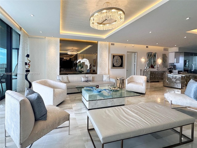 living room featuring recessed lighting, visible vents, a raised ceiling, and an inviting chandelier