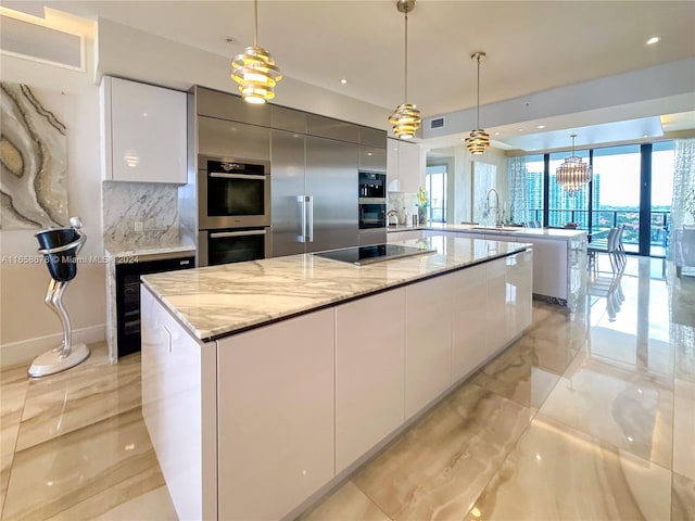 kitchen featuring white cabinets, double oven, modern cabinets, and black electric stovetop