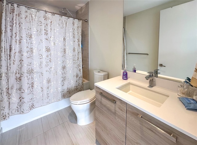 bathroom with shower / bathtub combination with curtain, toilet, and vanity