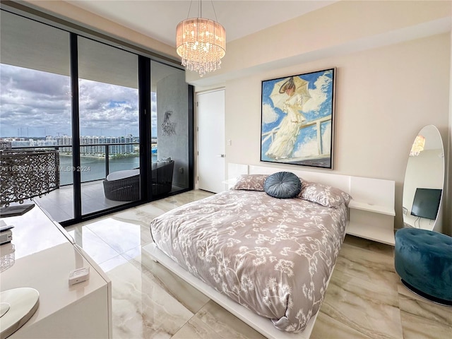 bedroom with a notable chandelier and access to outside