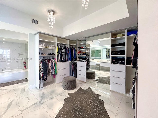 spacious closet with visible vents and marble finish floor