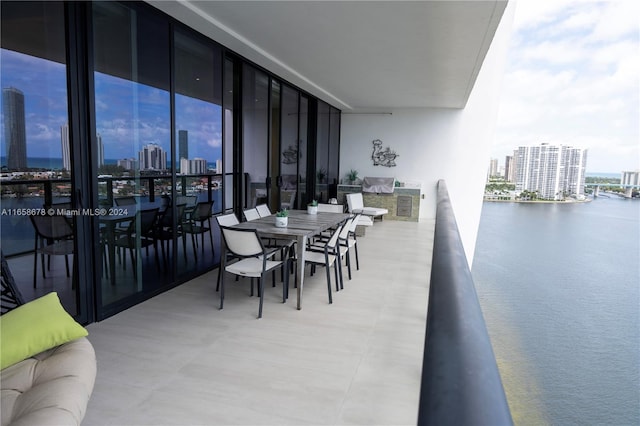 balcony with a view of city and a water view