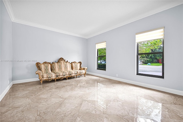 living area featuring marble finish floor, baseboards, and ornamental molding