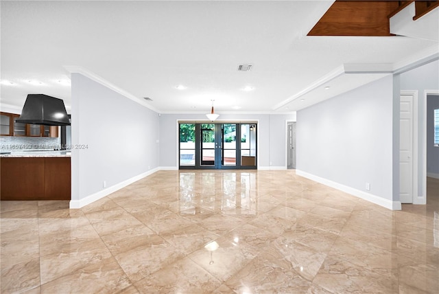unfurnished living room with recessed lighting, marble finish floor, visible vents, crown molding, and baseboards